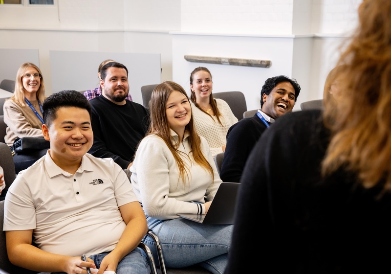 A staff audience listeding to a talk