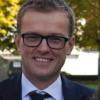 Dr Adam J. Brown